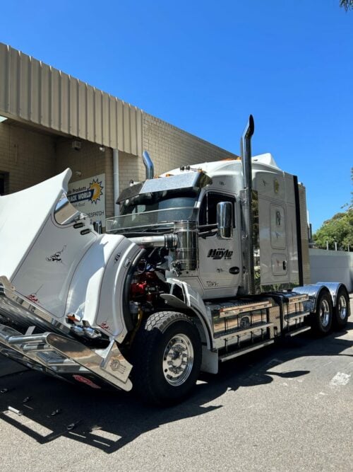a Kenworth T610 getting a Silver Windscreen Stoneguard fitted.